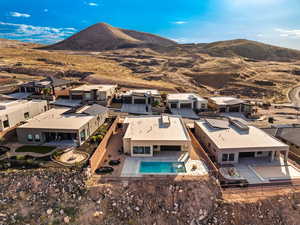 Aerial view of residential area featuring a mountain backdrop