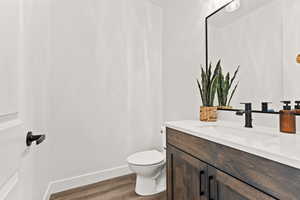 Bathroom featuring vanity and wood finished floors