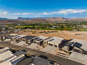 Aerial perspective of suburban area featuring a mountain backdrop