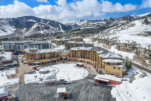 Snowy aerial view featuring a mountain view