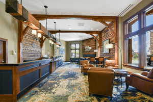 Living room featuring beamed ceiling, carpet flooring, visible vents, and recessed lighting