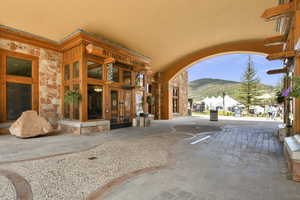 View of patio with french doors and a mountain view