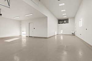 Garage featuring baseboards