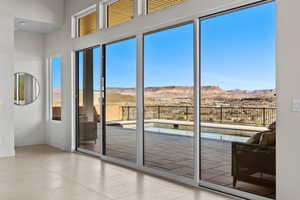 Entryway featuring a mountain view and baseboards