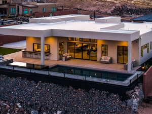 Back of house with a patio, outdoor lounge area, and a fenced in pool