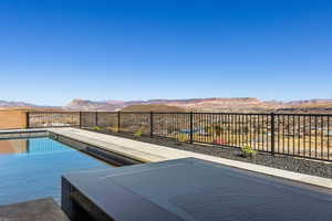 View of pool featuring fence, a mountain view, and a fenced in pool