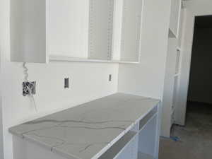 Kitchen with light stone counters