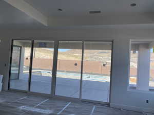 Doorway to outside with concrete flooring