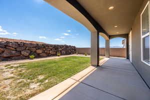 View of patio with a fenced backyard