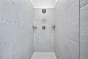 Bathroom featuring a tile shower