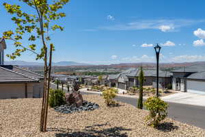 Property view of mountains with a residential view