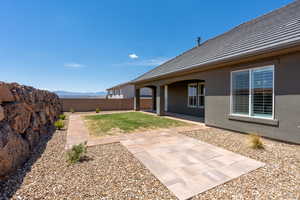 View of yard featuring a patio area, a fenced backyard, and a mountain view