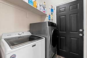 Laundry room with laundry area and independent washer and dryer