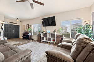 Living area featuring a ceiling fan