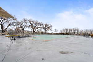 Community pool with a patio area