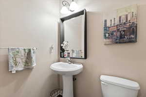 Half bathroom featuring toilet