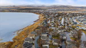 Aerial view featuring a residential view and a water and mountain view