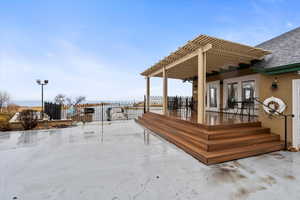 Club House Deck with fence and a pergola