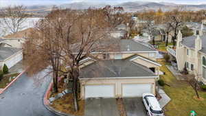 Birds eye view of property featuring a residential view and a mountain view
