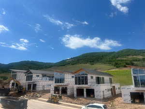 Front of property with a mountain view