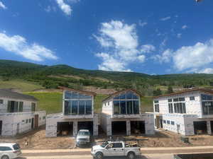 Front view of property featuring a mountain view