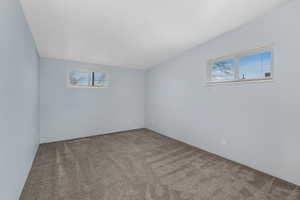 Large corner bedroom with two windows