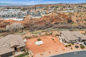 Birds eye view of property with a residential view and a mountain view