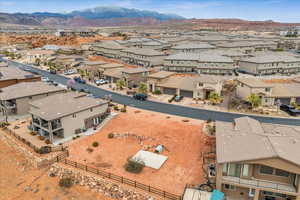 Birds eye view of property with a residential view and a mountain view