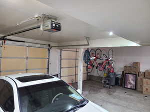 Garage featuring a garage door opener