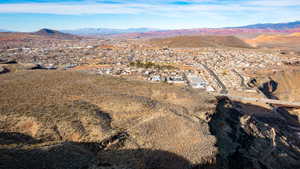 Birds eye view of property with a mountain view