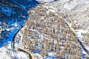 Snowy aerial view with a mountain view