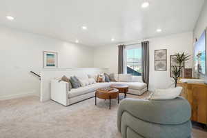 Loft area with baseboards, recessed lighting, and carpet