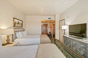 Bedroom featuring visible vents