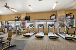 Workout area featuring a textured ceiling