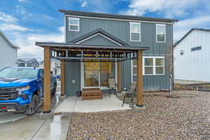 Rear view of property featuring board and batten siding