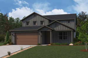 View of front of home featuring board and batten siding, a front lawn, driveway, and an attached garage