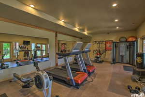 Exercise room featuring recessed lighting, french doors, and baseboards