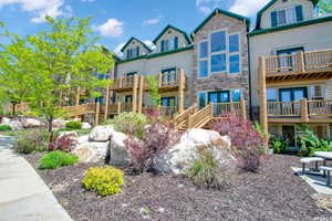 Exterior space featuring stone siding