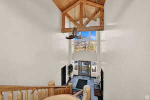 Interior space with high vaulted ceiling, wooden ceiling, and beam ceiling