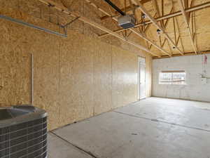 Garage with cooling unit and a garage door opener