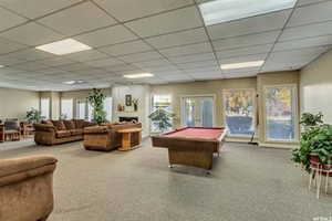 Game room with a paneled ceiling, pool table, and french doors