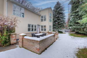 Back of house featuring a patio area and stucco siding