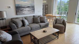 Living room featuring light wood-style flooring