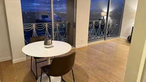 Dining area with baseboards and wood finished floors