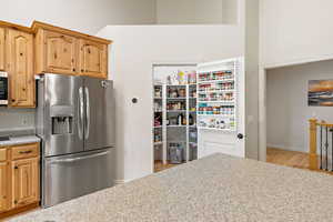 Kitchen with stainless steel appliances and light countertops