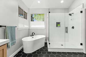 Full bathroom with recessed lighting, a soaking tub, a stall shower, baseboards, and tile patterned floors