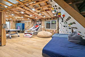 Bedroom with wood-type flooring