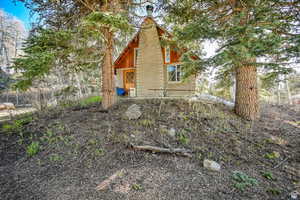 View of property exterior featuring a chimney