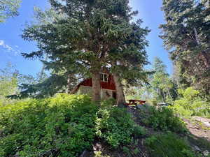 View of side of property featuring a barn