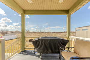 Deck featuring area for grilling